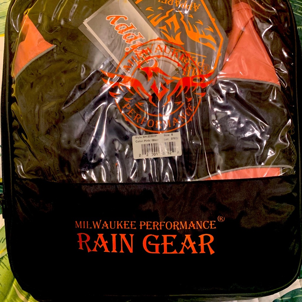 Women’s motorcycle rain gear, size S. Brand new, with tags.